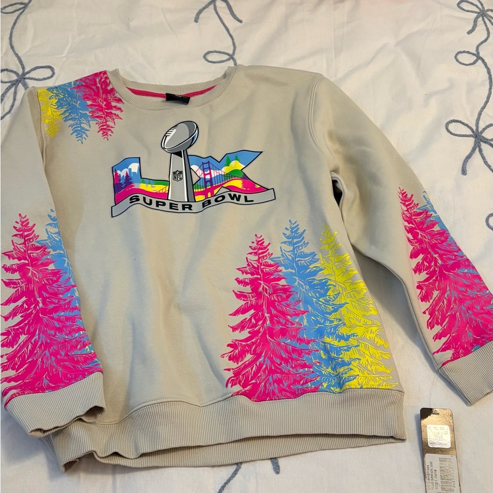 NFL Team Apparel Youth Sweatshirt in Cream with Pink Trim